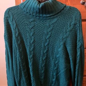 green turtleneck sweater